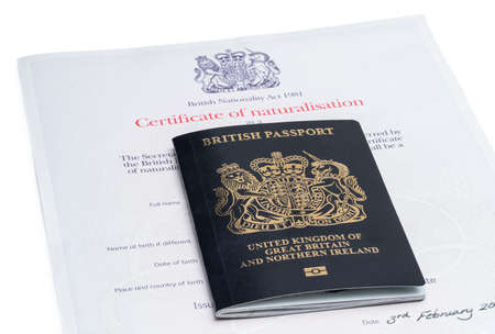 First Iconic blue post brexit 2021 style British passport with naturalization certificateの写真素材