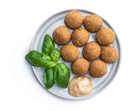 Mini scotch eggs in ceramic plate isolated on whiteの写真素材