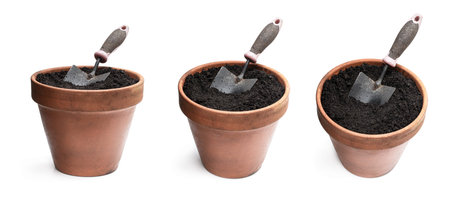 Set of  old ceramic flower pot with soil and garden trowel isolated on white