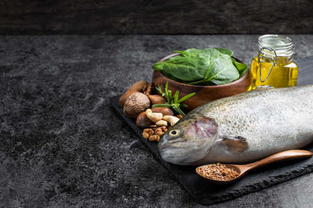 Set of  food with fats and omega-3 on dark backgroundの写真素材
