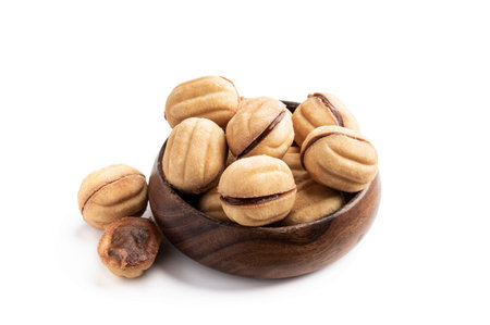traditional  russian walnut tea-cakes in wooden bowl isolated on white