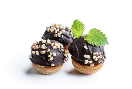 Round  chocolate cookies filled with toffee cream isolated on whiteの写真素材