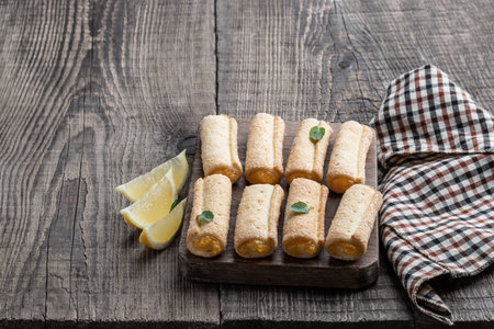 Homemade lemon cookies on wooden table