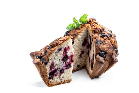 Homemade big blueberry muffin isolated on whiteの写真素材