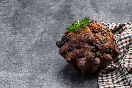 Homemade big berry muffin on concrete backgroundの写真素材