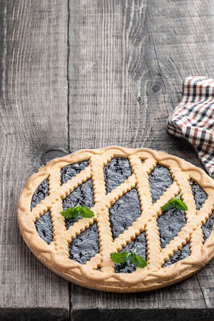 Homemade blueberry pie on rustic wooden tableの写真素材