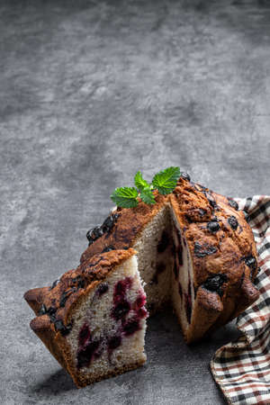 Homemade big berry muffin on concrete backgroundの写真素材