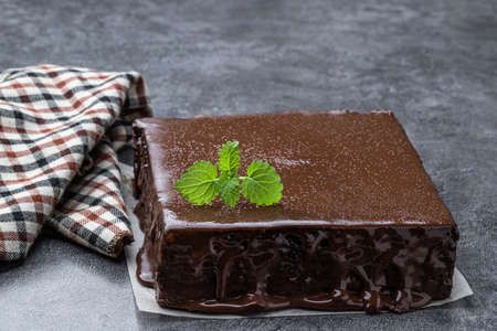 Delicious chocolate layered cake on gray backgroundの写真素材