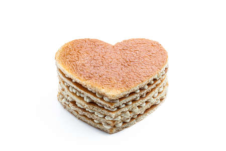 Homemade Heart shaped layered cake isolated on white. Ready to decorateの写真素材