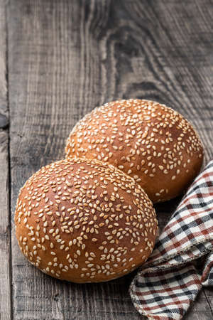 Hamburger buns on wooden tableの写真素材