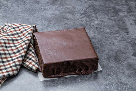 Delicious chocolate layered cake on gray backgroundの写真素材