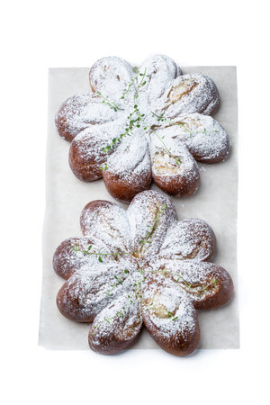Freshly baked daisy bun isolated on a white