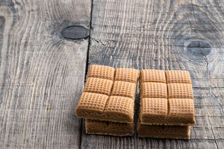 Tasty caramel candy on rustic wooden tableの写真素材