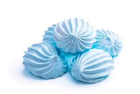 Blue colored meringues pack isolated on whiteの写真素材