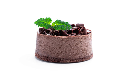 Mini Chocolate Cheesecakes with chocolate chips on top isolated on white