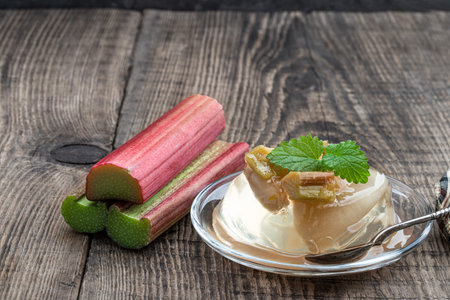 Fruit yellow jelly with rhubarb jam on wooden table