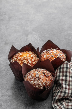 Homemade delicious wholegrain muffins on gray backgroundの写真素材