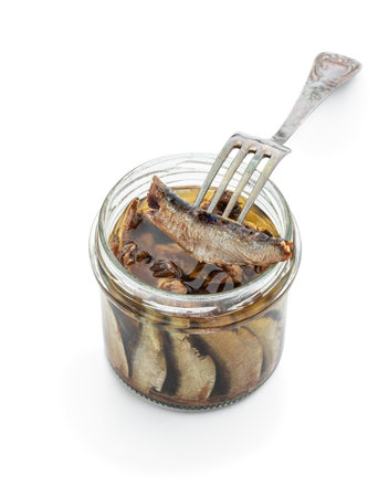 Smoked Sprats in glass jar isolated on a white backgroundの写真素材