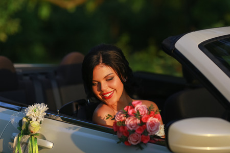 bride and groom. Young wedding couple enjoying romantic moments outside on a summer meadow. Happy bride and groom on their wedding. Stylish beautiful happy bride and groom, wedding celebrationsの写真素材