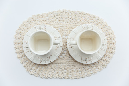 two white cup on the white backgroundの写真素材