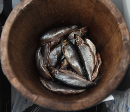 Herring in a wooden barrel - sea fish.の写真素材
