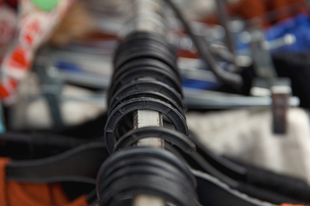 Selective focus clothes hangers in the store with blur. Close up.の写真素材