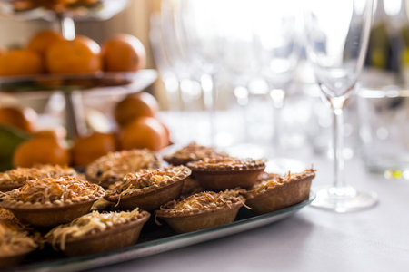 Snacks set. Bruschetta, canapes, salads desserts tartlets oysters on tableの写真素材