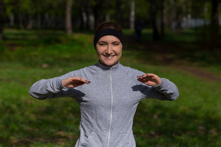 Young beautiful woman exercising outdoors. fitness, sport, exercising, people and lifestyle conceptの写真素材