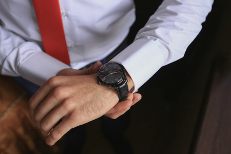 closeup fashion image of luxury watch on wrist of man. body detail of a business man. Man's hand.の写真素材