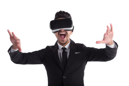 Young man in suit and 3d glasses isolated screaming on white background.. Cyber reality technology