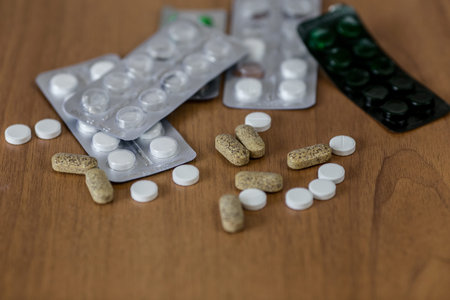Disease concept. No to drugs and pills concept. Packaging of tablets and pills on the table.