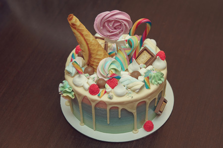 Birthday cake with decoration for children's birthday on table.の写真素材