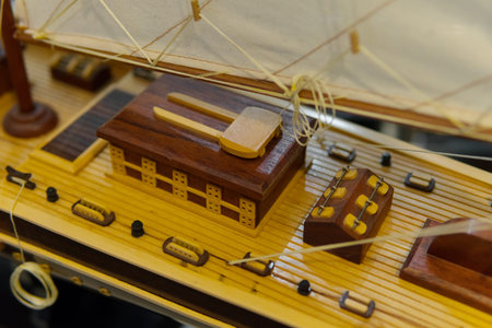 Sailing ship model in souvenir shop, closeup. Handmade sailboat miniature in gift market. Showcase...