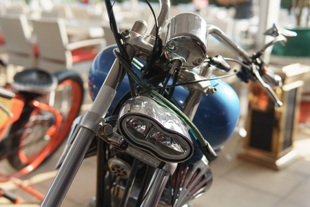 Recycled old retro motorcycle with a blue gas tank. Front view.の写真素材