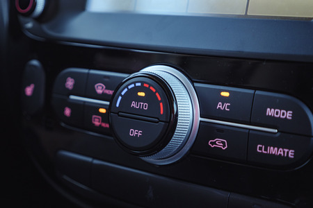 buttons of radio, dashboard, climate control in car close upの素材 [FY310117091621]