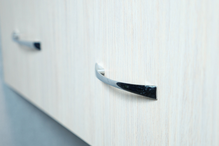 close up of drawer handle of closet compartment, selective focusの写真素材