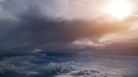 Stunning of aerial view among clouds from airplane window with blue sky. View from the airplane...