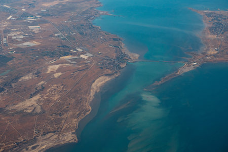 Aerial view of sea islands and boats from the plane, flight to sea vacation.
