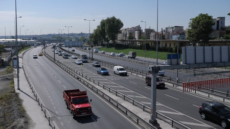 ISTANBUL, TURKEY - JULY 30 2019: Automobiles drive on modern highway running along calm azure sea against clear blue sky on sunny dayのeditorial素材