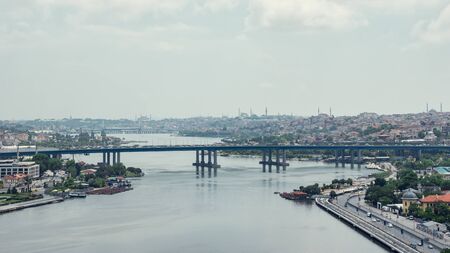 Aerial view on bridge across the Bosphorus river and Istanbul beautiful cityscape in evening. Time lapse Turkeyの写真素材