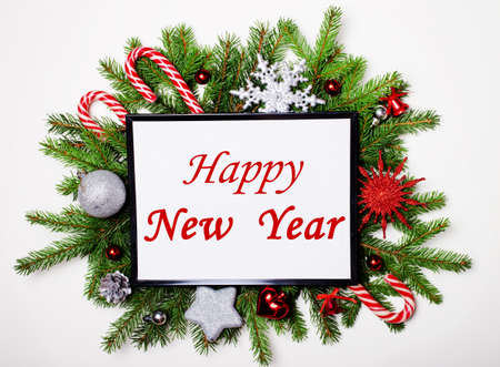Postcard HAPPY NEW YEAR on a Christmas wreath. Festive conceptの写真素材