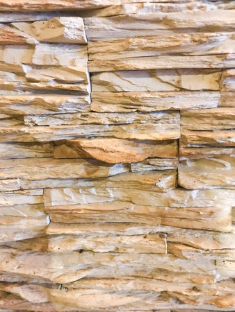 A modern brick wall of light decorative stone.