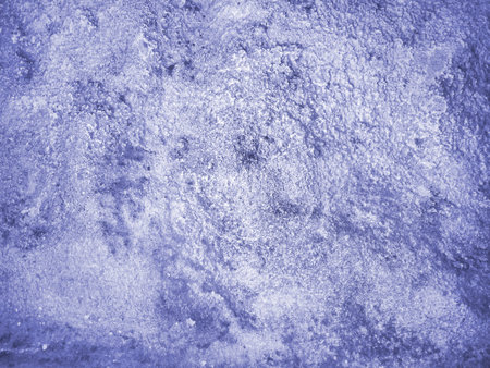 This is an abstract background of foaming water or periwinkle-colored clouds. The texture is bubbly....