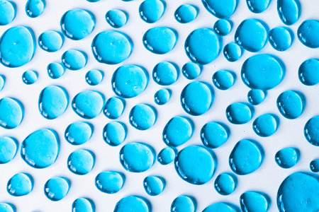 Gel blue drops forming a background. The concept of protection against viruses or cosmetics. Perfect...