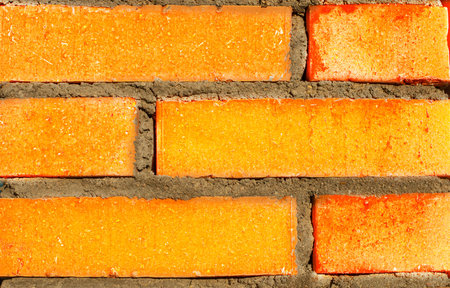 Texture background of an old vintage brick wall in red-yellow color. The perfect backdrop for your...