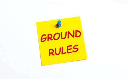 On a white background under the red button is a yellow sticker with the text GROUND RULESの写真素材