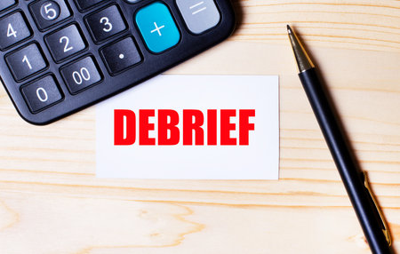 Word DEBREF on white paper with calculator and pen on wooden backgroundの写真素材