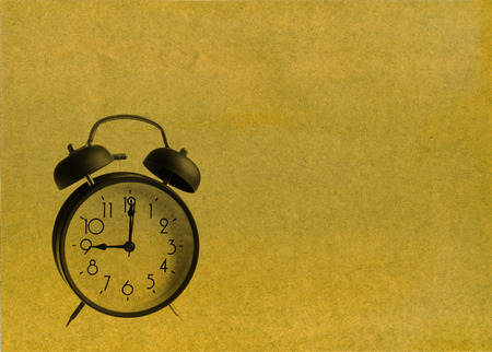 Old-fashioned alarm clock paper backgroundの写真素材