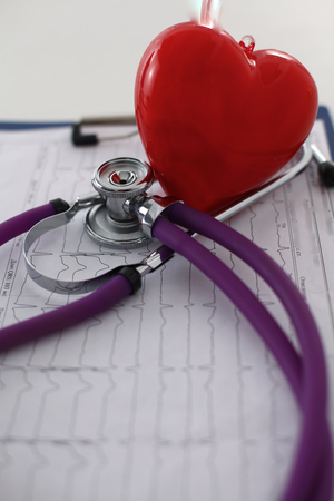 Medical stethoscope and heart isolated on white.の写真素材