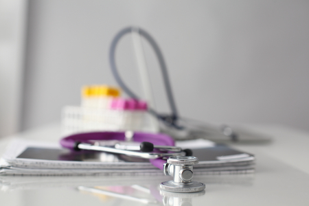 Pills ,tablets and stethoscope on white background.の写真素材